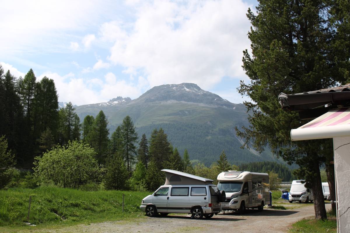 Two RVs in a scenic park