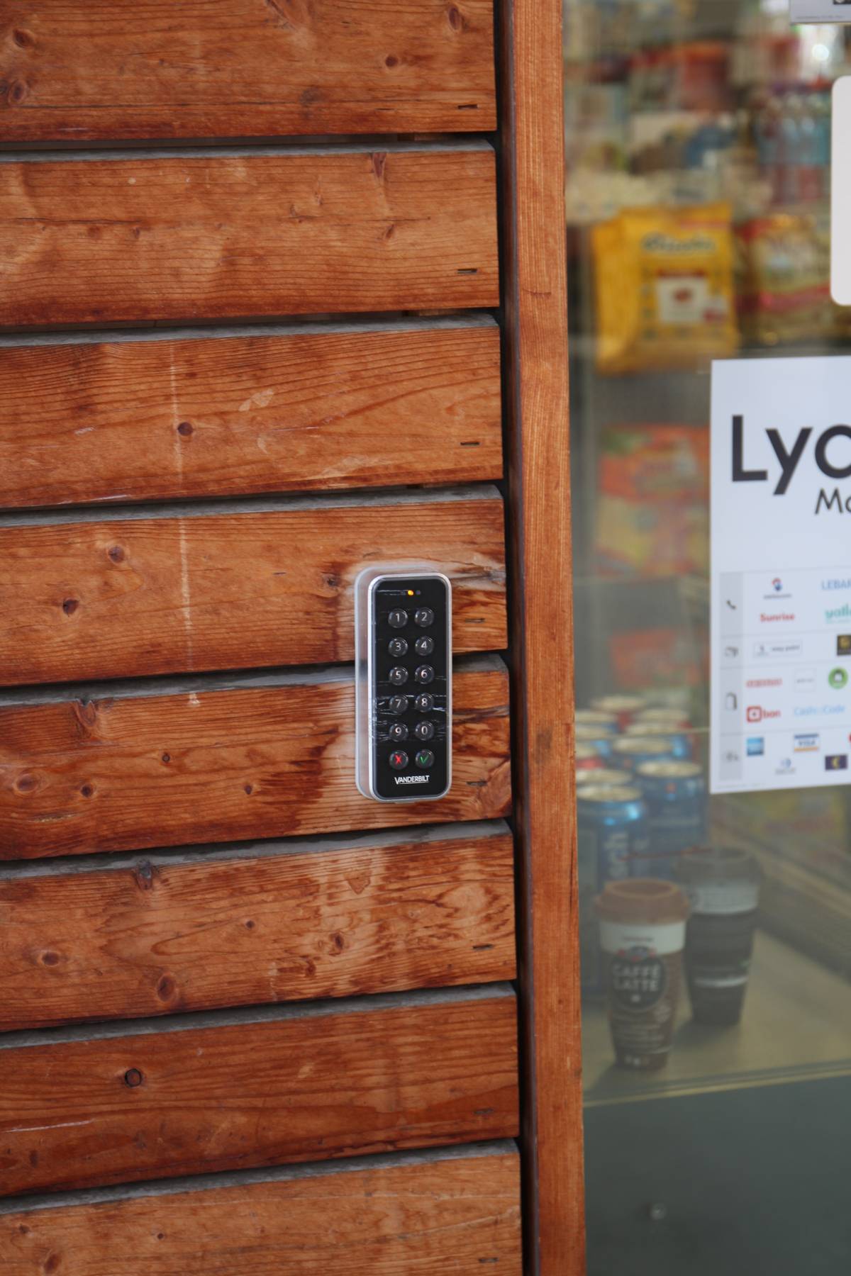A stained wood siding with a Vanderbilt branded 10 digit keypad on it