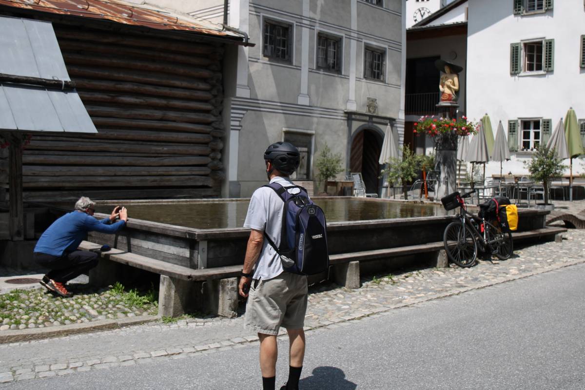 My dad waits to take a photo of the largest water fountani