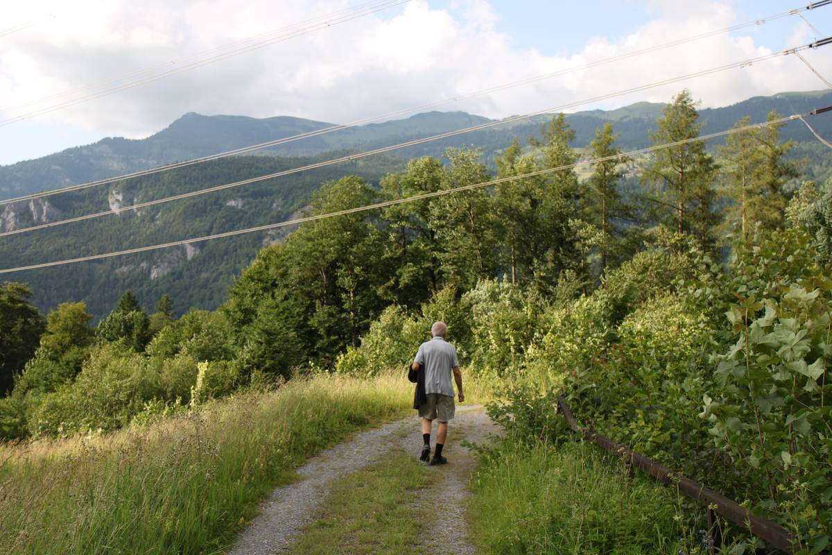 My dad walks down a farm path